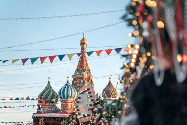 istock Christmas decorations. Christmas tree branches near to St. Basil's Cathedral on Red square in Moscow 1182468996