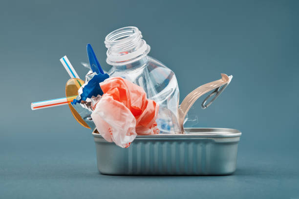 istock Open tin can. Plastic waste instead of fish inside. Ocean plastic pollution concept 1182469584