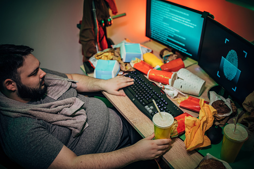 Hacker Eating Hacker Eating In Front Of The Computer Stock Photo - Download Image Now ...