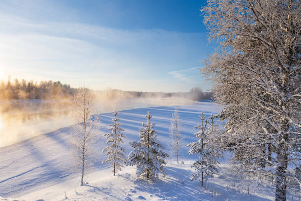 istock Mist over freezing river on a sunny cold winter day 1182470916