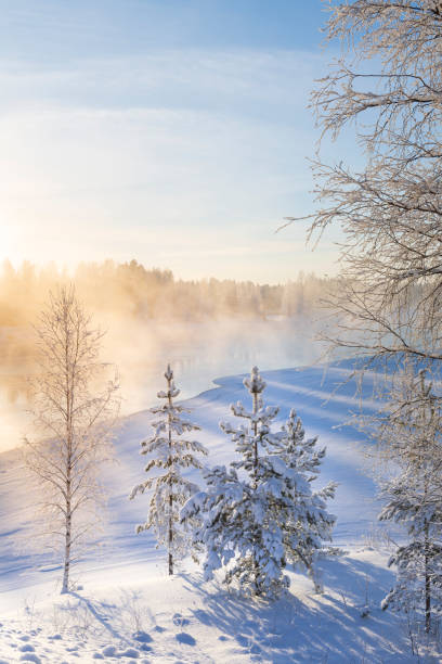 mist over freezing river on a sunny cold winter day - winter lake snow fog imagens e fotografias de stock