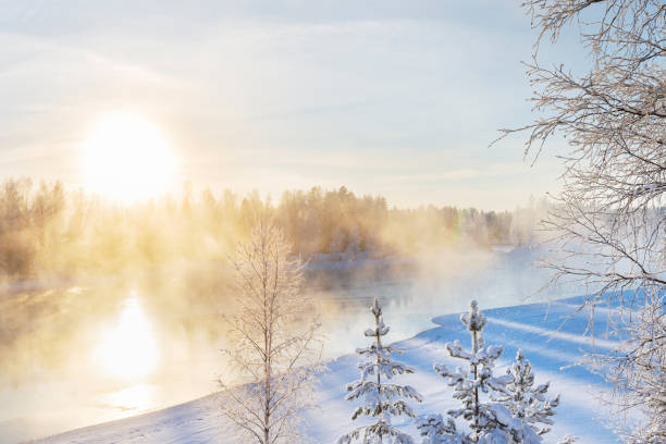 istock Mist over freezing river on a sunny cold winter day 1182471029
