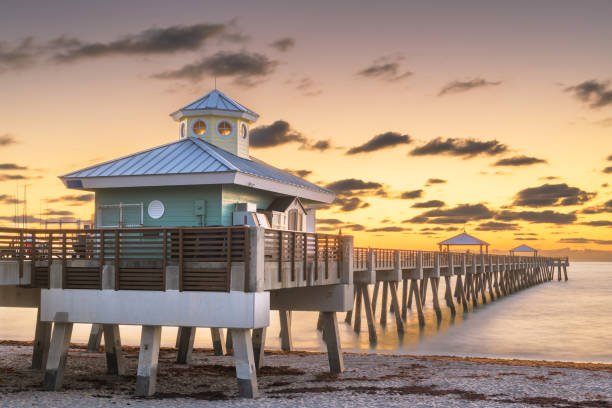 Juno Beach Pier just before sunrise Juno, Florida, USA at the Juno Beach Pier just before sunrise. west palm beach fl stock pictures, royalty-free photos & images