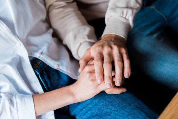 istock cropped view of man and holding holding hands 1182472875