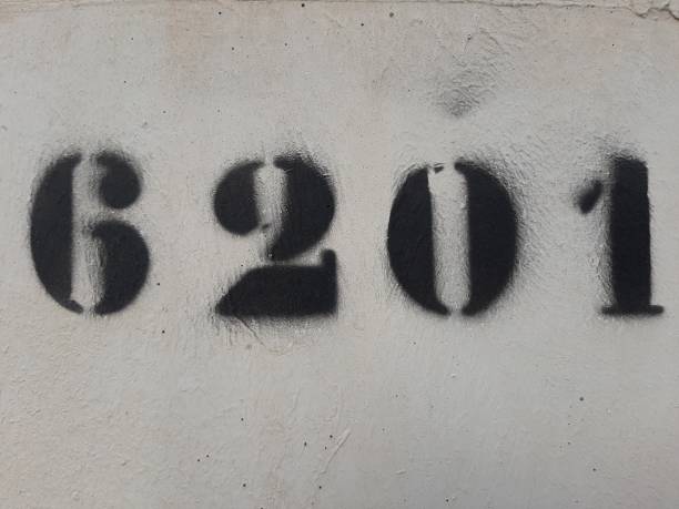 number six thousand two hundred and one painted stencil on concrete wall, number 6201