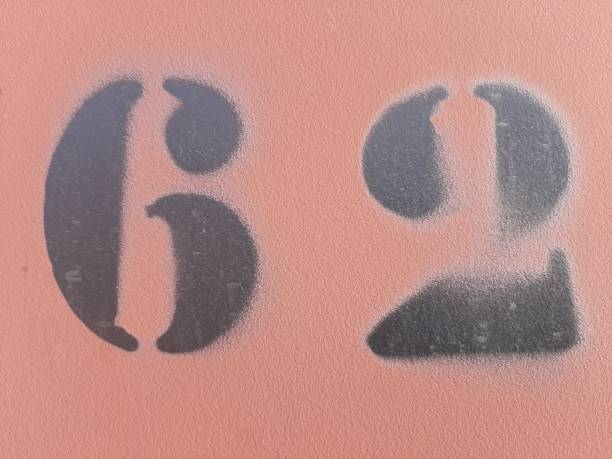 istock number sixty two painted stencil on concrete wall, number 62 1182472890