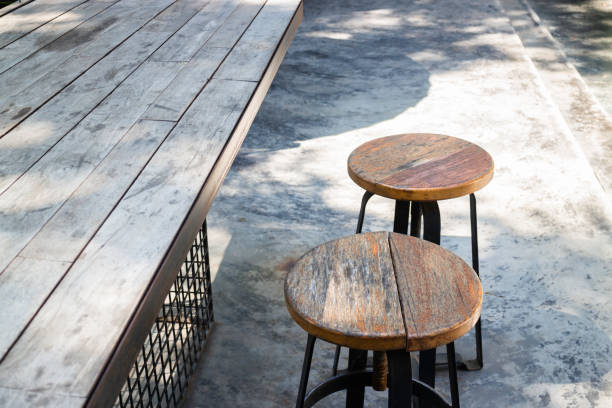 istock Wooden outdoors seats in summer garden 1182474455