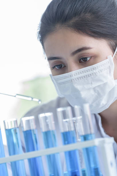 istock Asian young girl student scientist researching  and learning in a laboratory. 1182474507