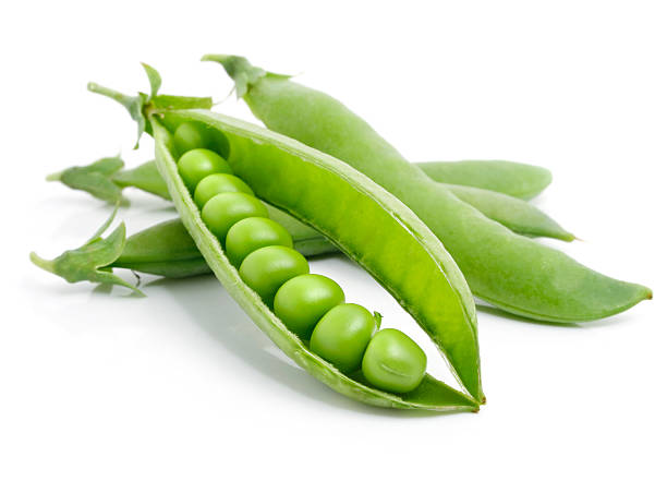istock Fresh green peas in the pod on white background 118247548