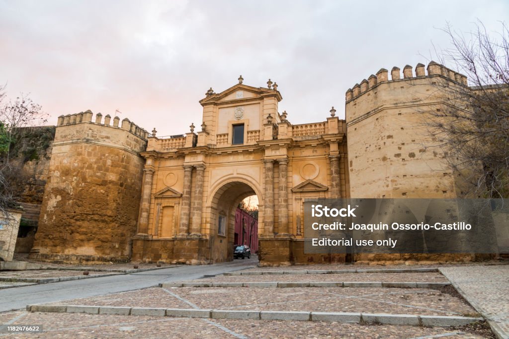 Carmona, Andalusia, Spain Carmona, Spain. The Puerta de Cordoba (Cordova Gate), one of the monumental entrances of the walled town of Carmona in Andalusia Alcazar Stock Photo