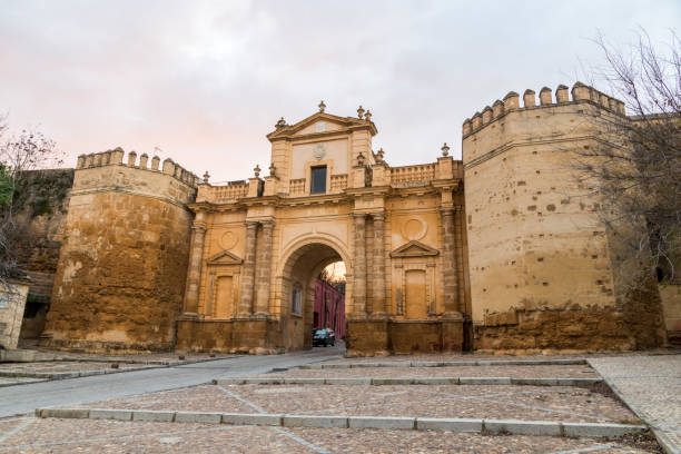 Carmona, Andalusia, Spain Carmona, Spain. The Puerta de Cordoba (Cordova Gate), one of the monumental entrances of the walled town of Carmona in Andalusia carmona stock pictures, royalty-free photos & images