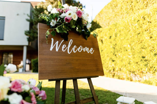 istock Welcome board with flower arrangement at wedding reception. 1182477426