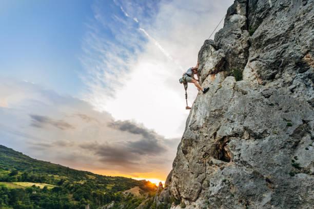 istock Disability young man free  climbing 1182477669