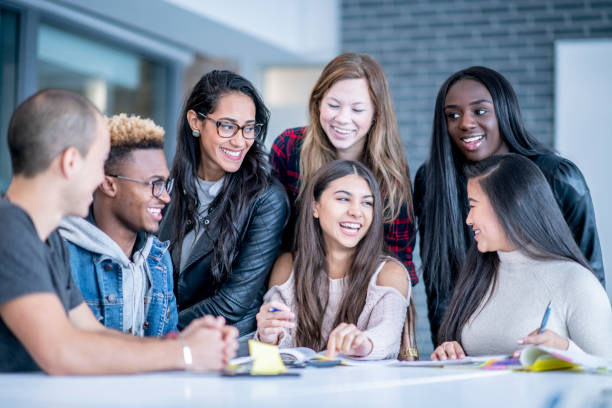 istock University Students Sharing Ideas stock photo 1182479296