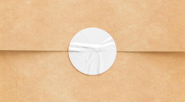 istock BLank white crumpled sticker on craft paper mock up 1182481974