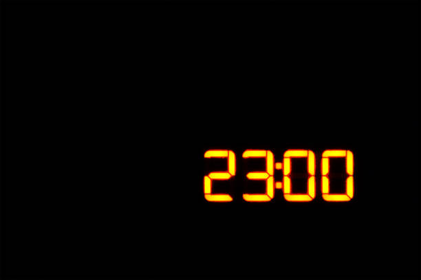 istock Time to sleep. night. exact evening time. 23:00 on the electronic clock display. 11:00 pm Time relax. copy space 1182482124