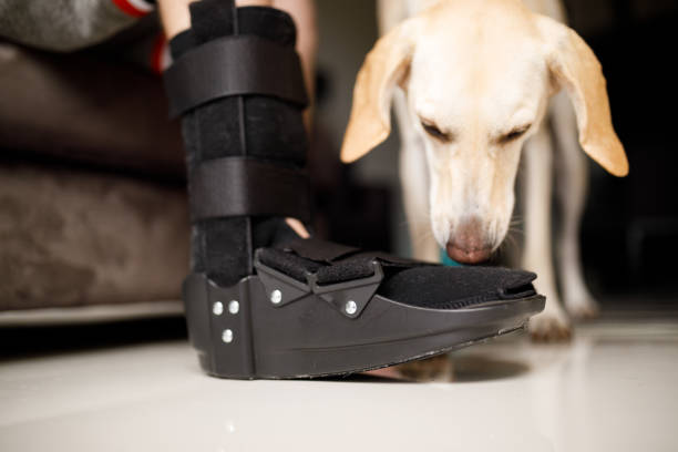 istock injured man wearing orthopedic boot 1182482266