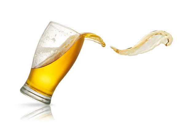 istock Beer splash in glass isolated on white 1182482758