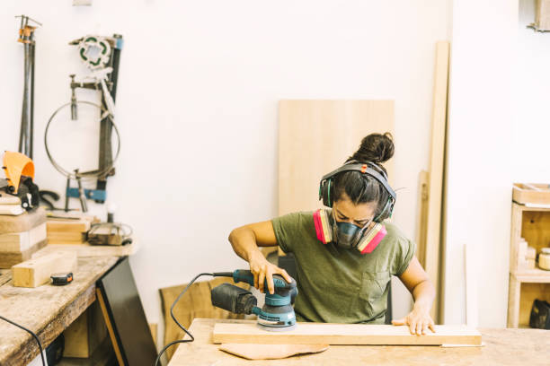 istock Young Woman Working with wood 1182482872