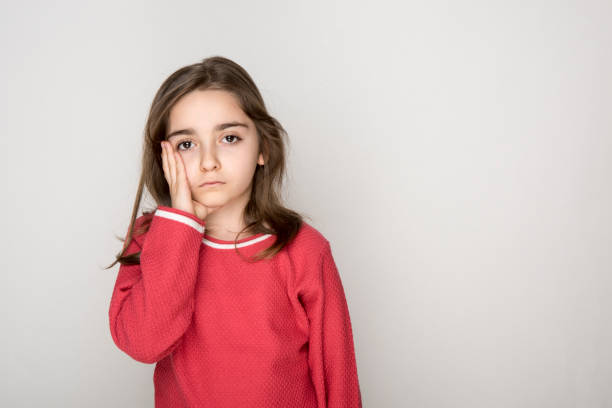 istock Girl with toothache 1182482953