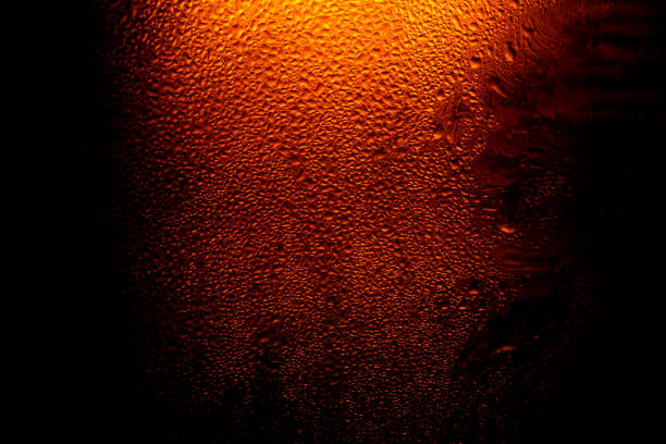 istock Water drops background,Refreshing Brown Cold Beer Bottle Covered With Condensation,Macro Beer Bottle 1182488636