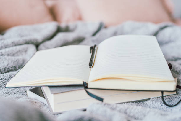 Beautiful teenage girl reading a book
