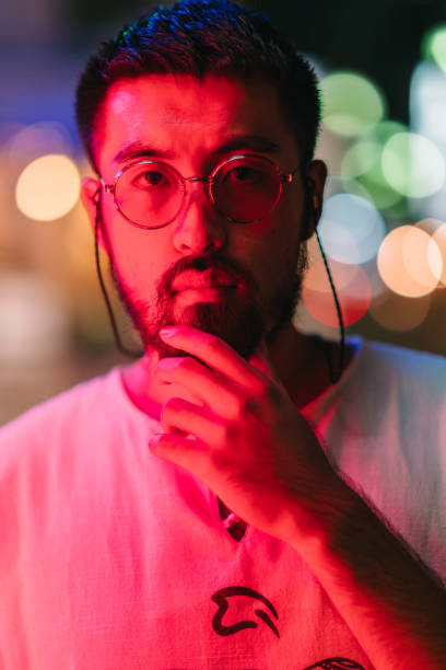 istock Portrait of young man at night 1182489927