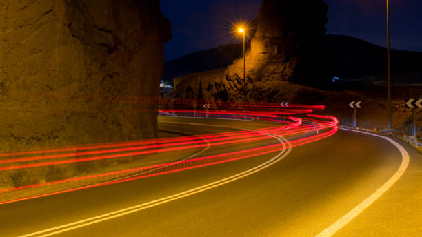istock Night Car Light on the road 1182490333
