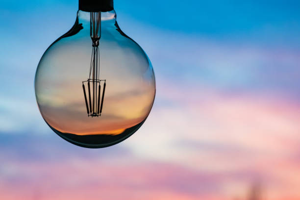 istock Sunset or sunrise in a light bulb 1182490484