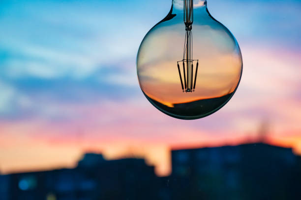 istock Sunset or sunrise in a light bulb 1182490485