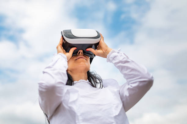 istock Business woman using vr goggles headset 1182491391
