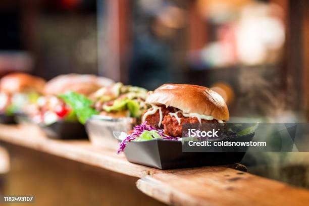Fresh Crispy Pork Burgers In A Row At Food Market Stock Photo - Download Image Now - Food, Burger, Restaurant