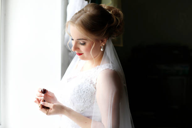 istock The bride tries on a dress 1182495413