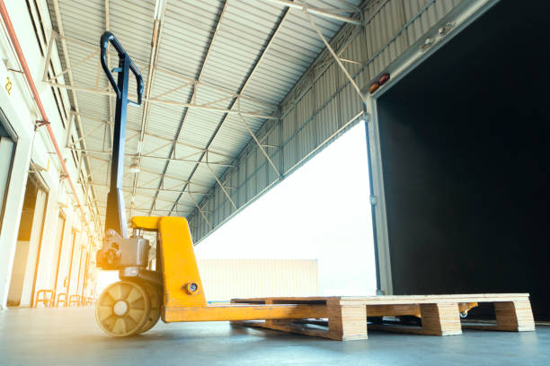 istock Hand pallet truck at warehouse dock 1182495422