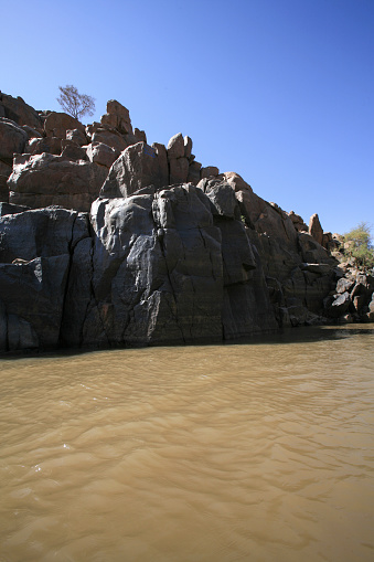 Large rock in the lush bushveld landscape in the Kruger National Park in South Africa