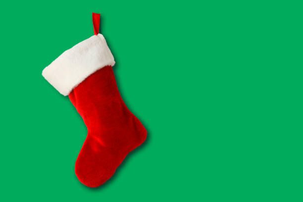 istock Christmas Stocking On A Green Background 1182497177