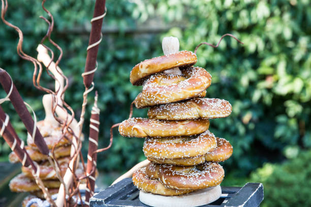 istock Freshly baked bagels sprinkled on the green background 1182498332