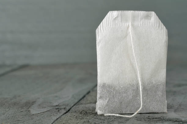 istock Tea bag as seen on a wooden background 1182499071