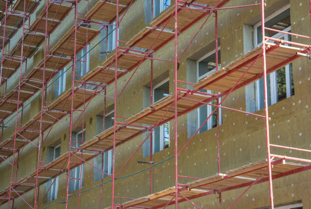 istock Mineral wool building insulation with scaffolding 1182499743