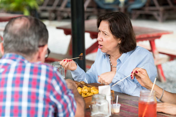 istock Latino adults eating typical food 1182500182