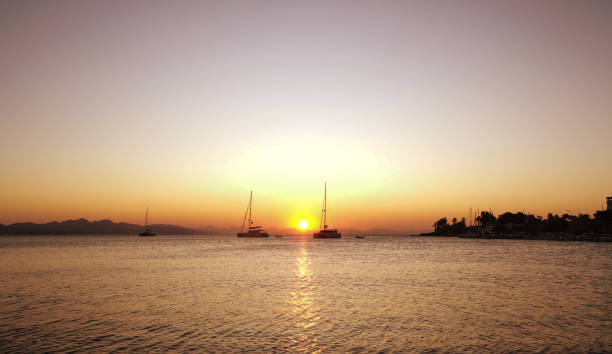 istock Sailing catamaran yachts moored in Datca bay at sunset 1182500203