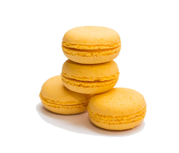 istock four yellow macaroons on a white background isolated 1182503117
