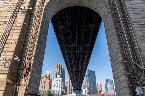 New York, United States of America - September 23, 2019: Arch under the Queensboro Bridge connecting Manhattan and Queens.