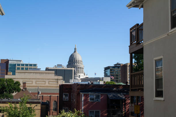 istock View of Wisconsin Capitol through buildings 1182505374