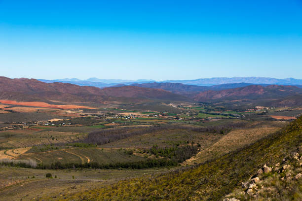 istock Green pastures in the valley between the mountains 1182507948