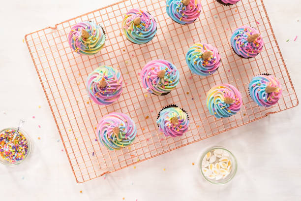 istock Decorating chocolate unicorn cupcakes 1182507960