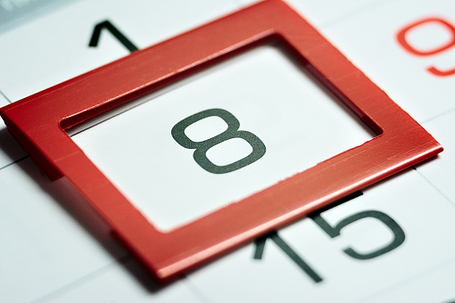 eighth day of the month highlighted on the calendar with a red frame close-up macro, mark on the calendar, eighth date