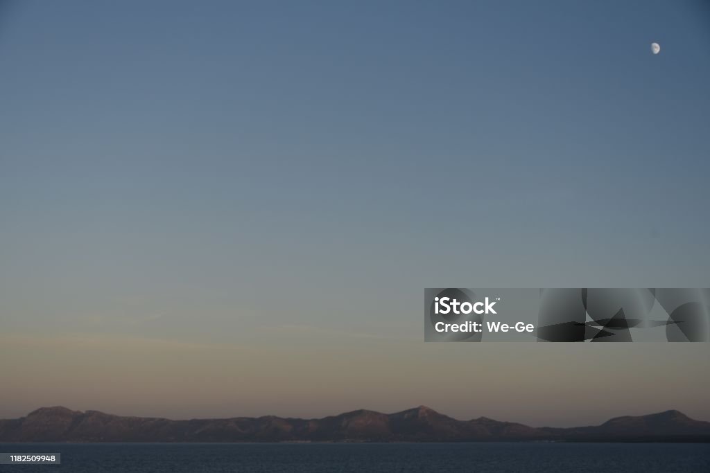 Atmospheric evening mood in the bay of Alcúdia, Mallorca, Spain Atmospheric Mood Stock Photo
