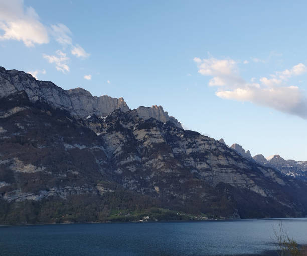 istock Clouds in the sky and blue. Below the Churfirsten mountain range with Lake Walensee. Switzerland 1182510826