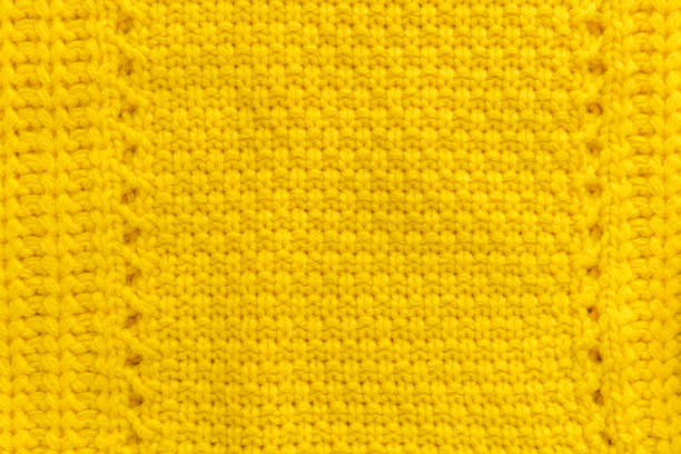 istock Yellow knitted sweater background 1182511145